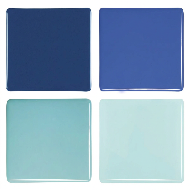 Four blue opaque glass Studio Squares on a white background