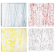 Four Bullseye collage glass Studio Squares with blue, red, yellow and grey-black frit and streamers