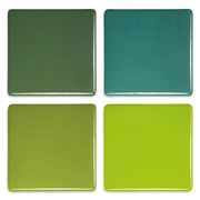 Four green opaque glass Studio Squares on a white background